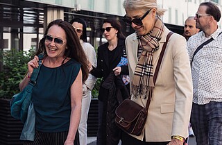 Creative Days Tour Two women walking in a group and laughing