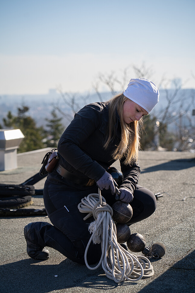 Female chimney sweep on the roof